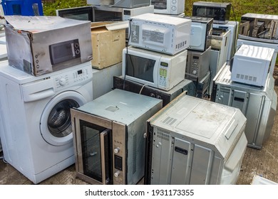 A Collection Of Domestic Applicance (Ovens, Microwaves And Washing Machines) Left At A Dump Or Recycling Center - Shutterstock ID 1931173355
