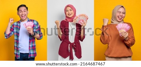 Collection of excited young Asian people holding money banknotes and celebrating success isolated on colorful background