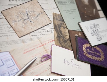 A Collection Of Family Artifacts Being Used To Research A Family Tree.