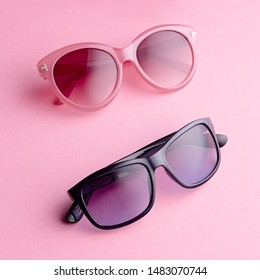 Collection fashionable sunglasses pink background  Sunglasses different shapes   colors flat lay