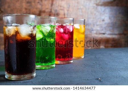 Collection of fizzy Soft soda drinks in the glass on the table.no alcoholic