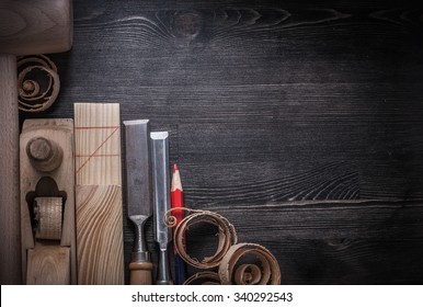 Collection of flat chisels planer wooden shavings plank mallet pencil. - Shutterstock ID 340292543