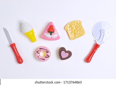 Collection Of Food Toys For Kids. Ice Cream, Slice Of Cake, Donuts. Flay Lay Image. White Background