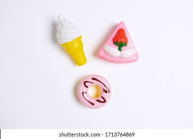 Collection Of Food Toys For Kids. Ice Cream, Slice Of Cake, Donuts. Flay Lay Image. White Background