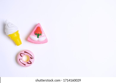 Collection Of Food Toys For Kids. Ice Cream, Slice Of Cake, Donuts. Flay Lay Image. White Background