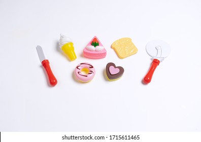 Collection Of Food Toys For Kids. Ice Cream, Slice Of Cake, Donuts. Flay Lay Image. White Background