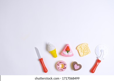 Collection Of Food Toys For Kids. Ice Cream, Slice Of Cake, Donuts. Flay Lay Image. White Background