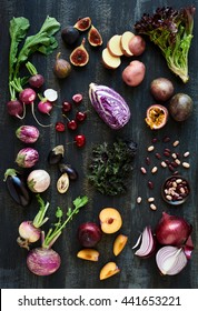 Collection Of Fresh Purple Toned Vegetables And Fruits On Dark Rustic Distressed Background, Heirloom Eggplant, Fig, Aubergine, Cherries, Radishes, Lettuce, Beans Passionfruit, Cabbage, Plum, Onion