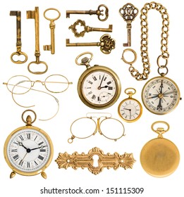 collection of golden vintage accessories. antique keys, clock, compass, glasses isolated on white background