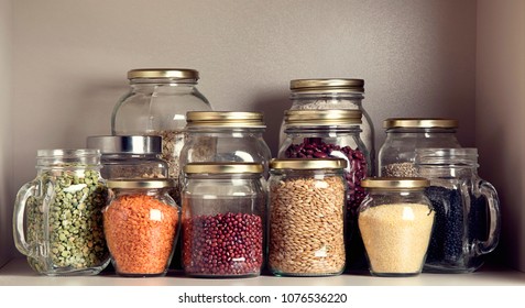 Collection Of Grain Products In Storage Jars In Pantry