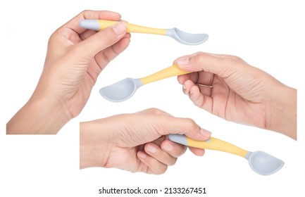 Collection Of Hand Holding Bendable Kids Training Spoon Fork Set Isolated On White Background.