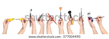 collection of hands holding tools for makeup isolated on white background