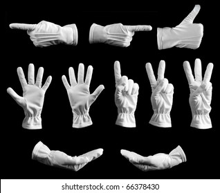 Collection of hands in white glove on black background.