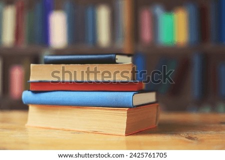 A collection of history books and encyclopedias on a table in the library