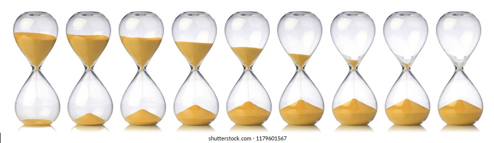 Collection of hourglasses with yellow sand showing the passage of time - Shutterstock ID 1179601567