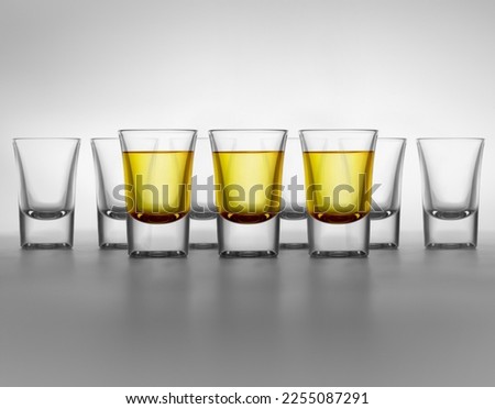 Collection of Liquor glasses on table.