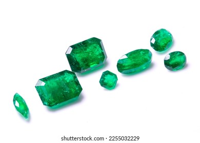 A collection of loose Emerald gemstones. Single stones for jewellery. Isolated on a white background - Shutterstock ID 2255032229