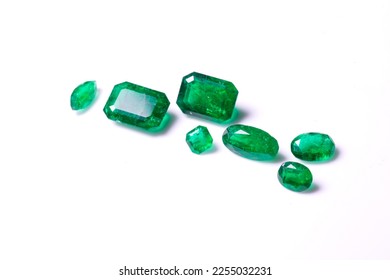 A collection of loose Emerald gemstones. Single stones for jewellery. Isolated on a white background - Shutterstock ID 2255032231