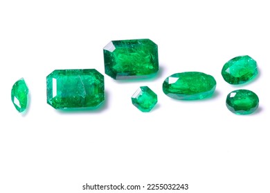 A collection of loose Emerald gemstones. Single stones for jewellery. Isolated on a white background - Shutterstock ID 2255032243
