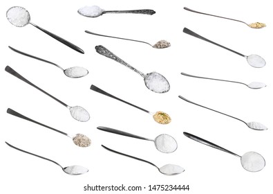 collection from metal spoons with various salts isolated on white background
