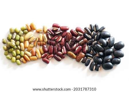 Collection of mix bean ( red kidney, green mung, black bean, soy beans, and millet ) isolated on white background.