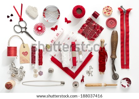 a collection needle work accessories in red on white background