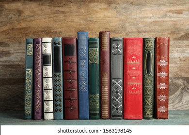 Collection of old books on wooden shelf
