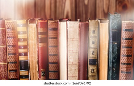 Collection Of Old Books On Wooden Background