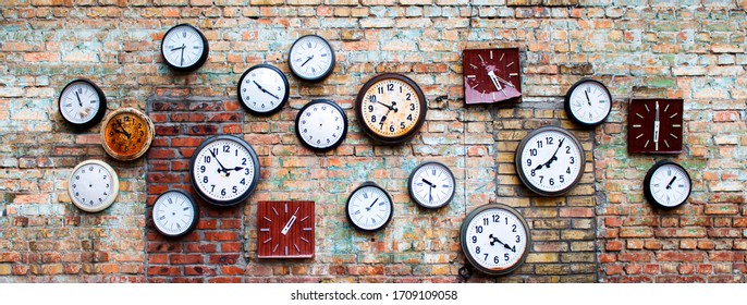 collection of old, vintage, hinged watches, all clock show different times, some do not have insoles, they all hang on an old brick wall, bricks changed color from time to time - Powered by Shutterstock
