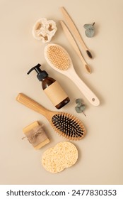 A collection of personal care items including a bamboo toothbrush, soap bar, clean brush, reusable bottle. Zero waste sustainable lifestyle concept. Eco friendly wellness and self care.
