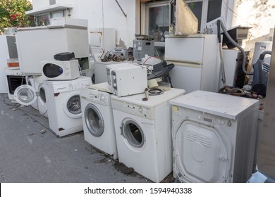 Collection place of old electric household appliances - broken and rusty microwaves, fridges, washing machines. Concept - ecological disposal, hazardous waste.