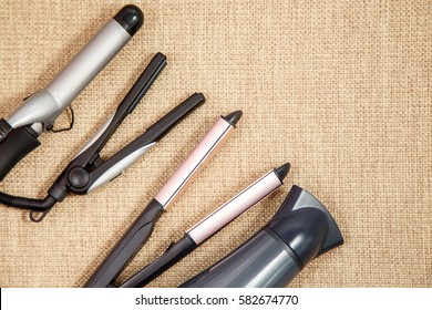 Collection of the professional hairdresser appliances - hair dryer, curling, corrugation, straightener top view