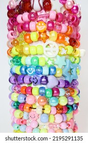 Collection Of Rainbow Beads Bracelets On White Background