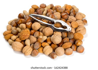 collection of shelled nuts and nutcracker