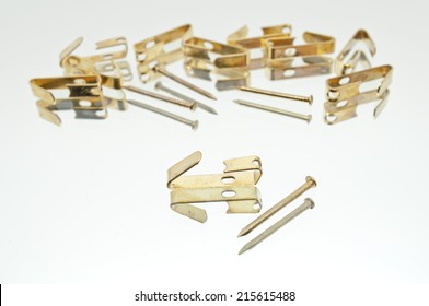 Collection Of Small Lying Metal Picture Hooks With Brads / Nails