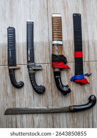 A collection of small machetes and sharp weapons used in the Debus performance.