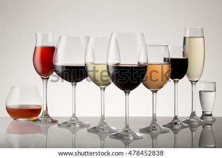 Collection of stemware with drinks.