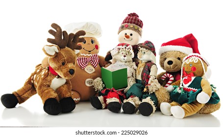 A Collection Of Stuffed Christmas Critters Surrounding Ma Bunny Who Holds A Christmas Carol Book (or Storybook) For The Others To Enjoy.  On A White Background.