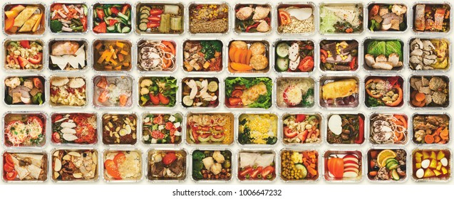 Collection of take away foil boxes with healthy food. Set of containers with everyday meals - meat, vegetables and law fat snacks on white background, top view