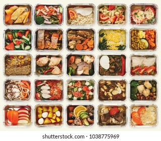 Collection of take away foil boxes with healthy food. Set of containers with everyday meals - meat, vegetables and law fat snacks on white background, top view