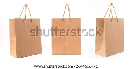A collection of three different angled views of eco-friendly brown paper shopping bags, isolated on a clean white background
