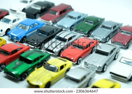 Collection of toy cars, colorful die-cast toy car on a row, white background, chidhood.