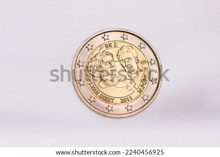 A collection of two euros commemorative coins. In a row, copy space. Concept of numismatic, finance, european currency