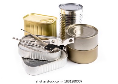 A Collection Of Unlabelled Food Tins Or Cans, Some With Pull Tabs, And A Manual Can Opener Isolated On White