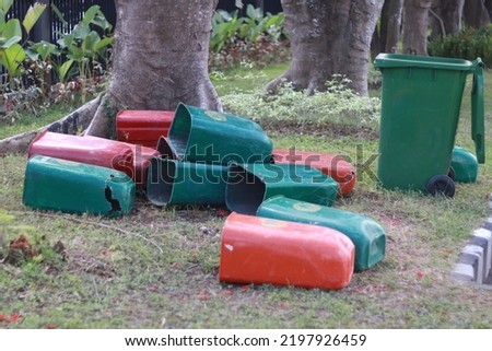 a collection of unused trash cans because they are damaged