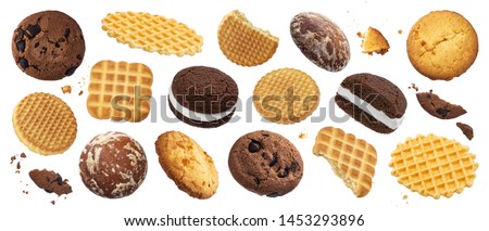 Collection of various cakes, cookies, crackers, waffles isolated on white background with clipping path. Delicious whole and broken sweet biscuits set