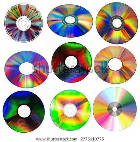 a collection of various compact discs (CDs) or digital versatile discs (DVDs) with reflective, rainbow-colored surfaces