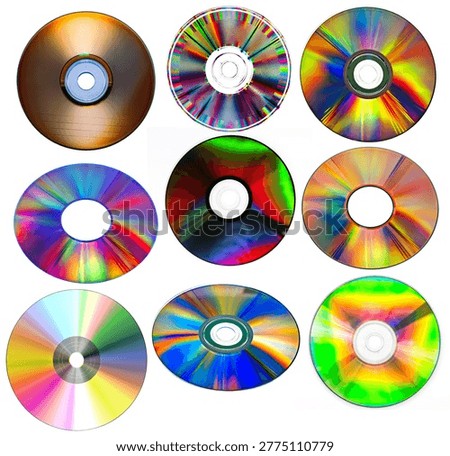 a collection of various compact discs (CDs) or digital versatile discs (DVDs) with reflective, rainbow-colored surfaces
