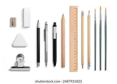 Collection of various pens, pencils, mechanical pencils, brushes, erasers, paper clip and ruler isolated on a white background. High resolution. 