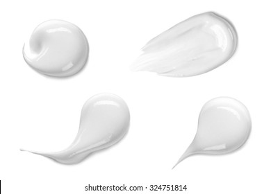 Collection Of Various Strokes Of A White Beauty Cream On White Background